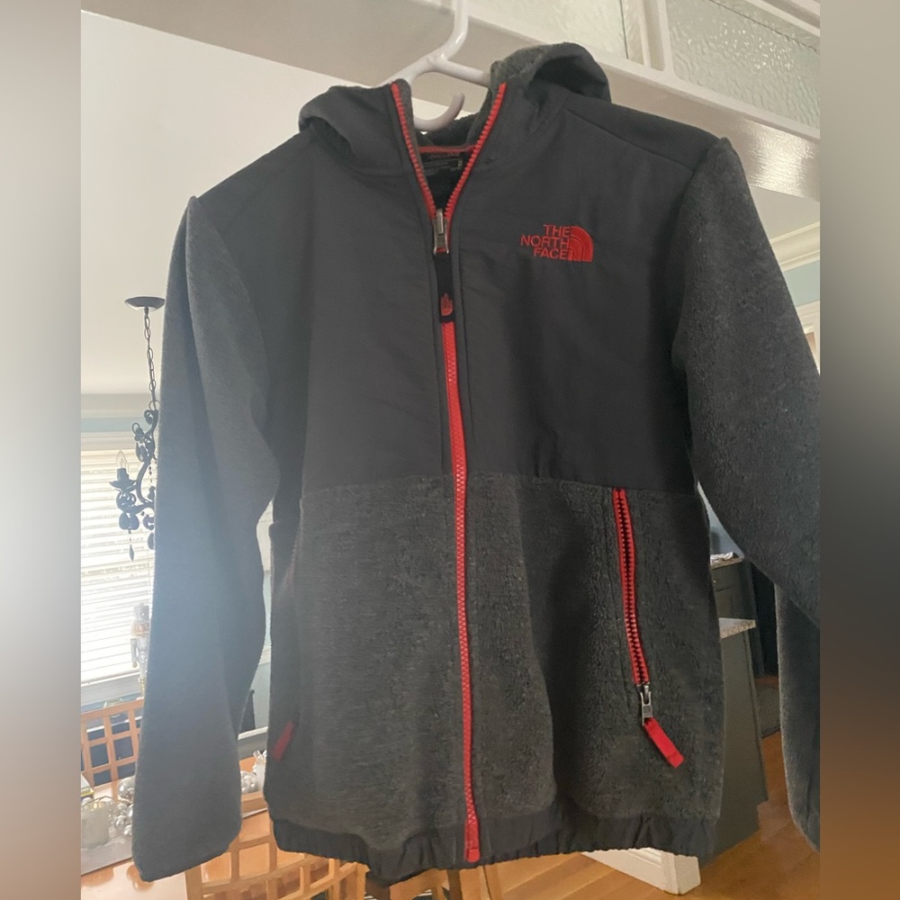 Boys North Face fleece zip up in med 10/12. Genteel used, no statins or tears